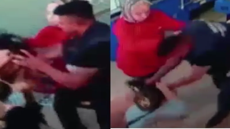 Markette eşiyle tartışan kadını saçından tutup yerde yumrukladı!